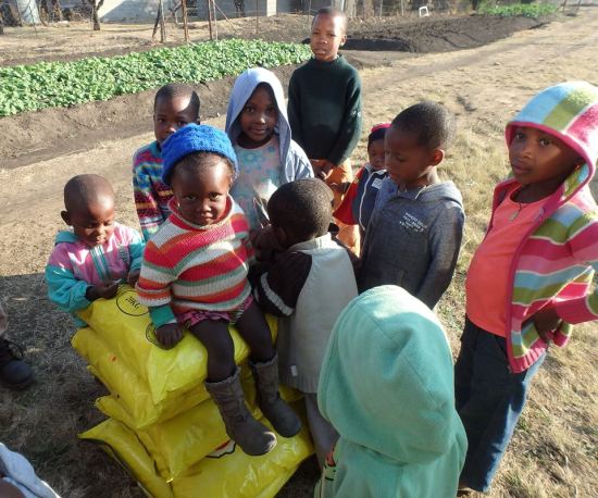 The Lesotho Orphans happy with food just brought in!